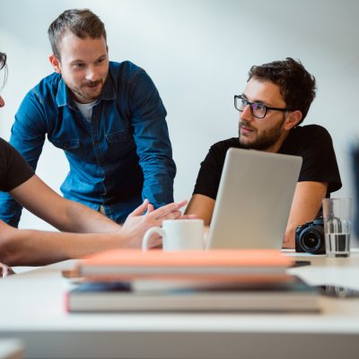 Team of young casual dressed people have a meeting in office.